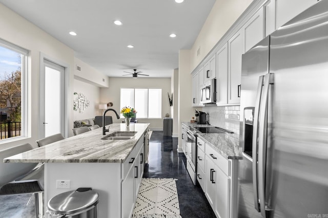 920 Park St, Little Rock, AR 72202 - kitchen with a center island with sink, stainless steel appliances, recessed lighting, and a sink