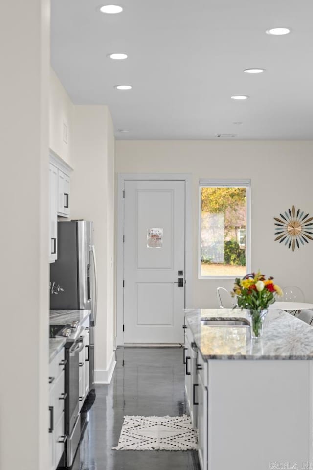 920 Park St, Little Rock, AR 72202 - interior space featuring baseboards, a sink, and recessed lighting