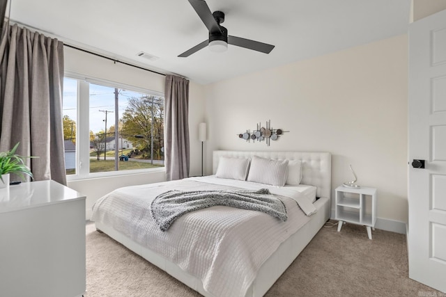 920 Park St, Little Rock, AR 72202 - bedroom with carpet flooring, visible vents, baseboards, and a ceiling fan