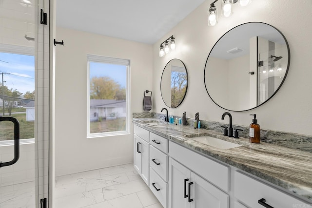 920 Park St, Little Rock, AR 72202 - full bath featuring a sink, double vanity, a shower stall, and marble finish floor