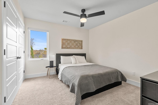920 Park St, Little Rock, AR 72202 - bedroom with light colored carpet, visible vents, baseboards, and a ceiling fan