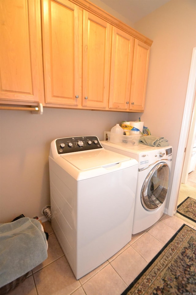 3810 Hanover Dr, Bryant, AR 72022 - laundry room with cabinet space, washing machine and dryer, and light tile patterned flooring