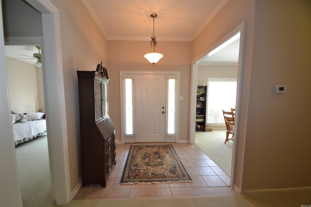 3810 Hanover Dr, Bryant, AR 72022 - foyer entrance with light colored carpet, crown molding, a wealth of natural light, and light tile patterned flooring