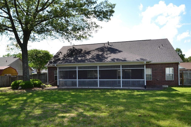 3810 Hanover Dr, Bryant, AR 72022 - back of property featuring a sunroom, brick siding, a fenced backyard, and a yard