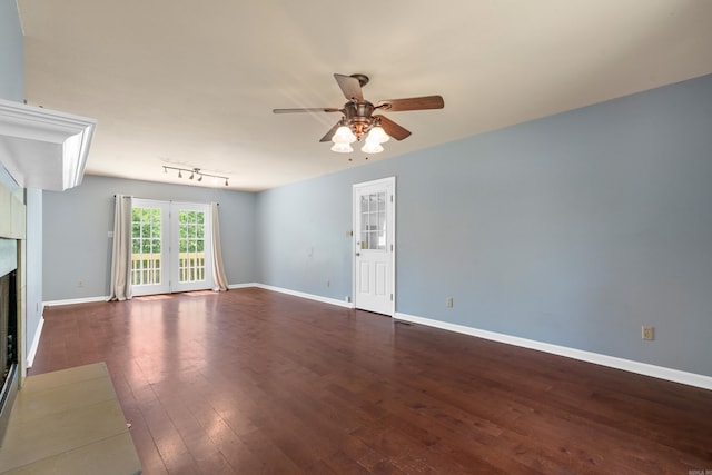 330 Melwood St, Hot Springs National Park, AR 71901 - unfurnished living room with a fireplace, ceiling fan, baseboards, and dark wood finished floors