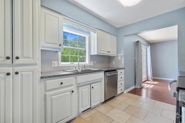 330 Melwood St, Hot Springs National Park, AR 71901 - kitchen featuring a sink, tasteful backsplash, white cabinets, stainless steel dishwasher, and baseboards