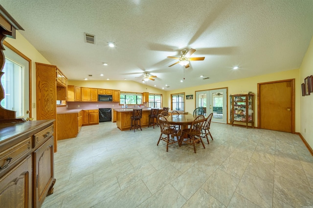 140 Bird Dove Ln, Heber Springs, AR 72543 - dining space featuring lofted ceiling, a healthy amount of sunlight, ceiling fan, and a textured ceiling