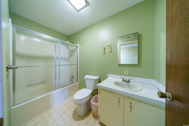 140 Bird Dove Ln, Heber Springs, AR 72543 - bathroom with a textured ceiling, toilet, bath / shower combo with glass door, tile patterned floors, and vanity