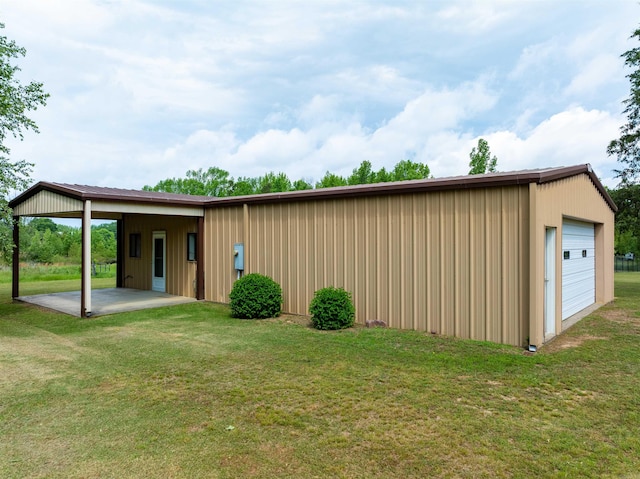 140 Bird Dove Ln, Heber Springs, AR 72543 - exterior space featuring a patio area, a detached garage, an outdoor structure, and a lawn