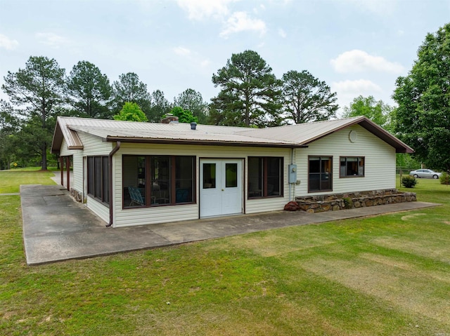 140 Bird Dove Ln, Heber Springs, AR 72543 - back of house featuring a lawn, a patio area, and metal roof