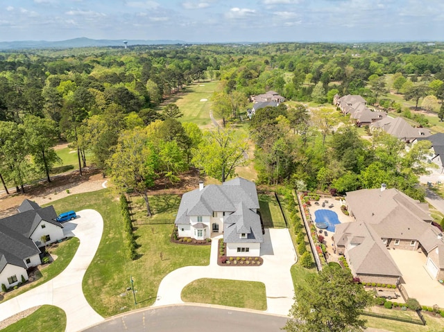 birds eye view of property with a wooded view and a residential view