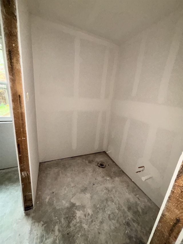 bathroom with unfinished concrete floors