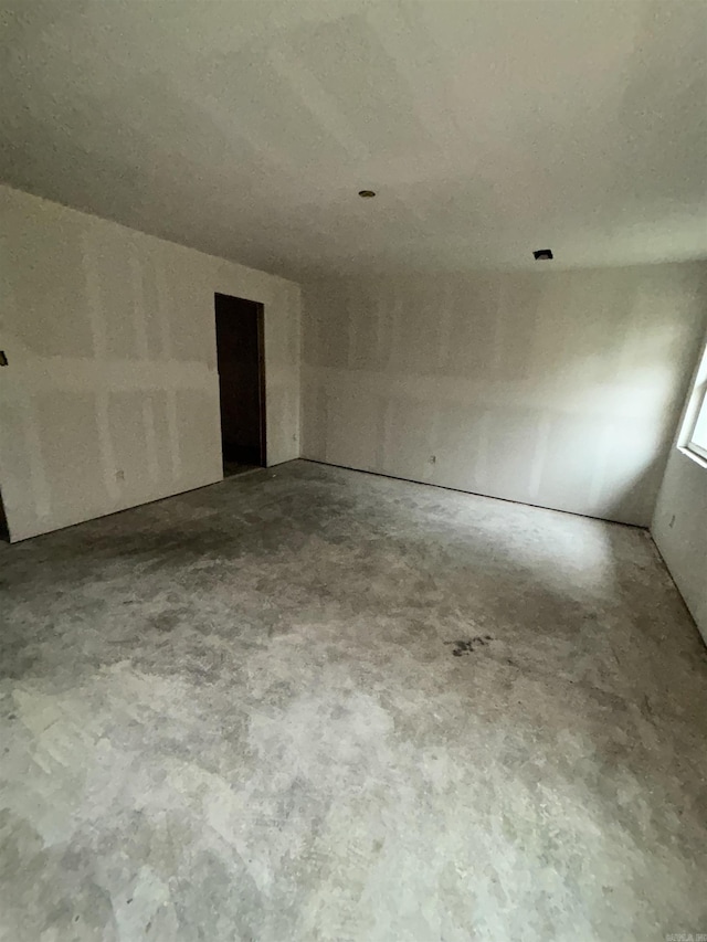 interior space with unfinished concrete flooring