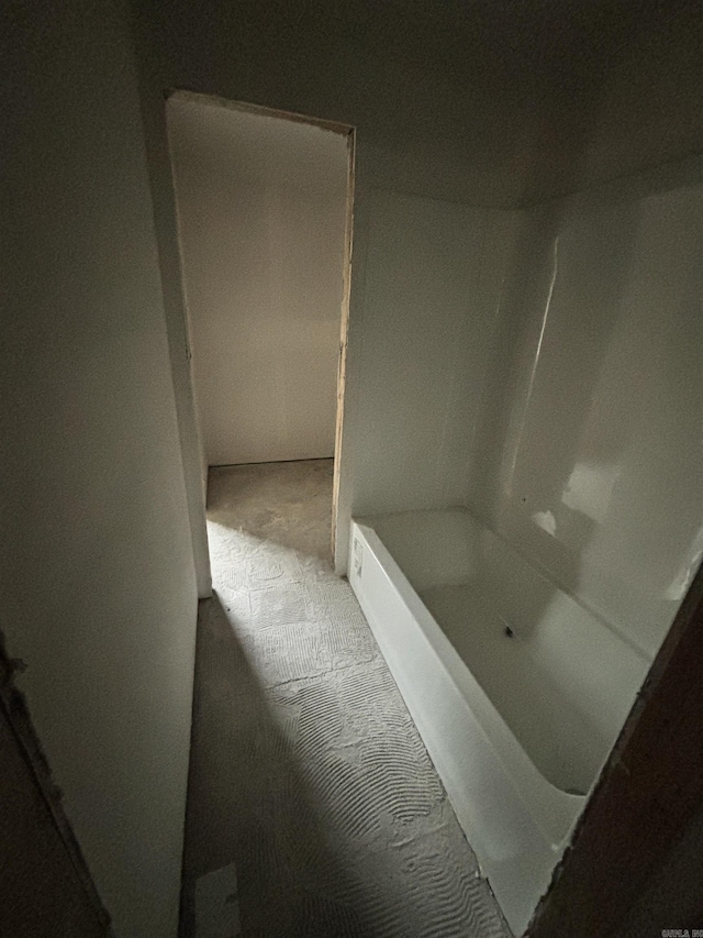 bathroom featuring a tub to relax in