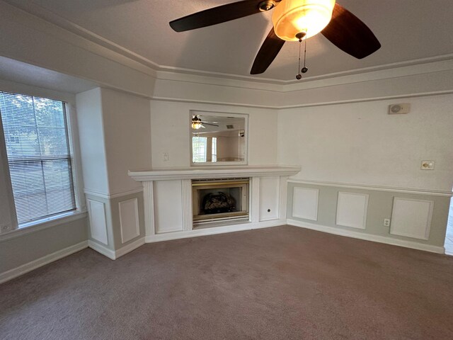 1906 Carolyn Dr, Jonesboro, AR 72404 - unfurnished living room featuring a ceiling fan, a wealth of natural light, a fireplace, and carpet