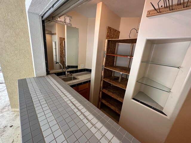 1906 Carolyn Dr, Jonesboro, AR 72404 - bathroom featuring a sink and a textured wall