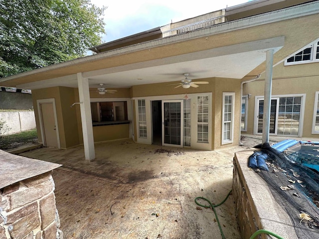 1906 Carolyn Dr, Jonesboro, AR 72404 - back of property featuring stucco siding, ceiling fan, and a patio