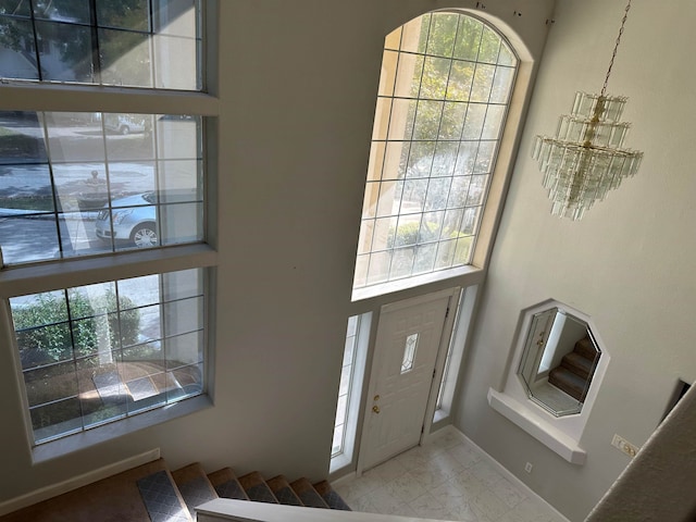 1906 Carolyn Dr, Jonesboro, AR 72404 - foyer featuring a wealth of natural light and a notable chandelier