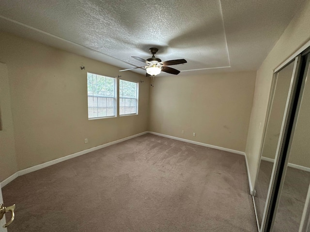 1906 Carolyn Dr, Jonesboro, AR 72404 - unfurnished bedroom with baseboards, light carpet, and a textured ceiling