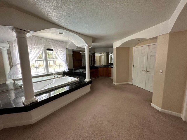 1906 Carolyn Dr, Jonesboro, AR 72404 - interior space with carpet, a textured ceiling, baseboards, and ornate columns