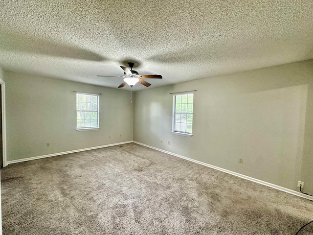 12921 Barth Rd, Alexander, AR 72002 - empty room with plenty of natural light, ceiling fan, carpet, baseboards, and a textured ceiling