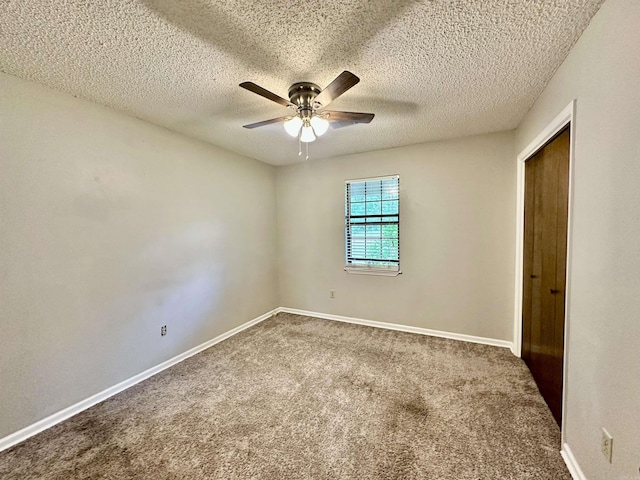 12921 Barth Rd, Alexander, AR 72002 - carpeted empty room with ceiling fan, baseboards, and a textured ceiling