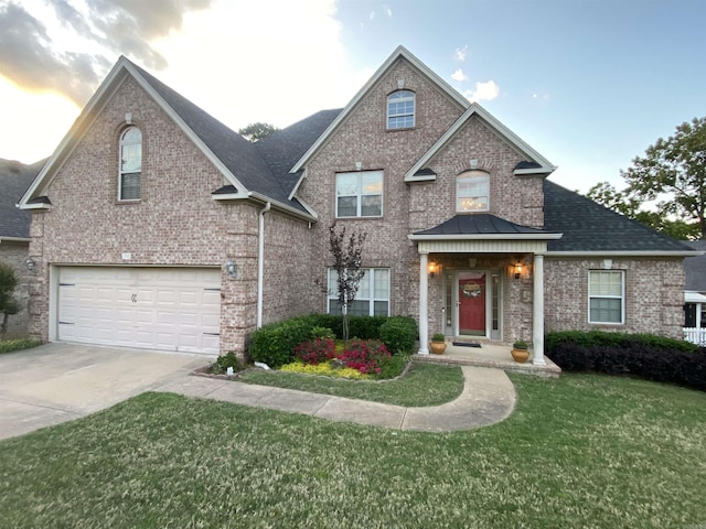 2808 Valley Park, Little Rock, AR 72212 - traditional-style home featuring a front lawn, brick siding, a garage, and concrete driveway