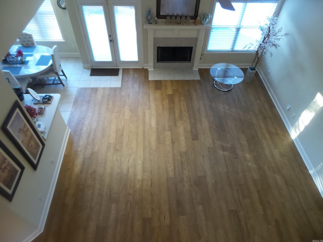 2808 Valley Park, Little Rock, AR 72212 - living area featuring a tile fireplace, a wealth of natural light, wood finished floors, and baseboards