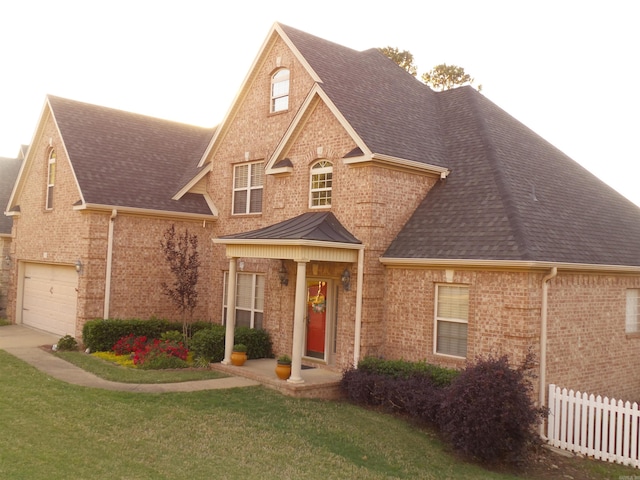 2808 Valley Park, Little Rock, AR 72212 - traditional-style house with a shingled roof, brick siding, fence, and an attached garage