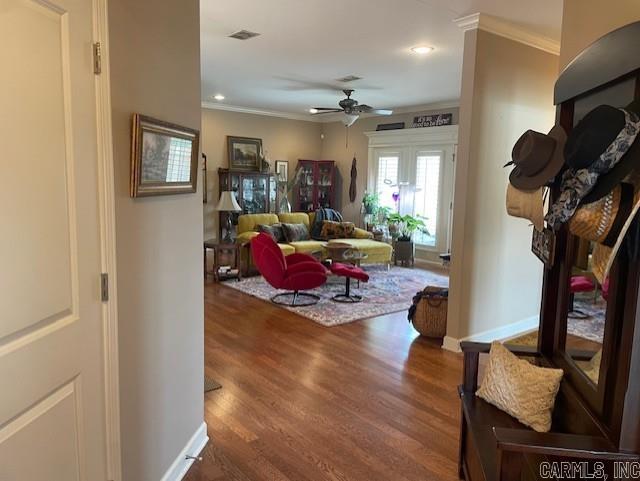 2241 Sage Meadows Cir, Sherwood, AR 72120 - living room featuring ornamental molding, visible vents, ceiling fan, and wood finished floors