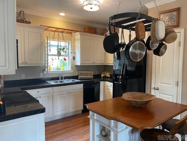 2241 Sage Meadows Cir, Sherwood, AR 72120 - kitchen featuring ornamental molding, a sink, black appliances, dark countertops, and white cabinets