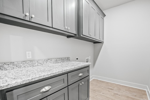 54 Lieblong Rd, Greenbrier, AR 72058 - laundry room with cabinet space, washer hookup, hookup for an electric dryer, light wood-type flooring, and baseboards