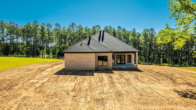 54 Lieblong Rd, Greenbrier, AR 72058 - back of house with a wooded view and brick siding