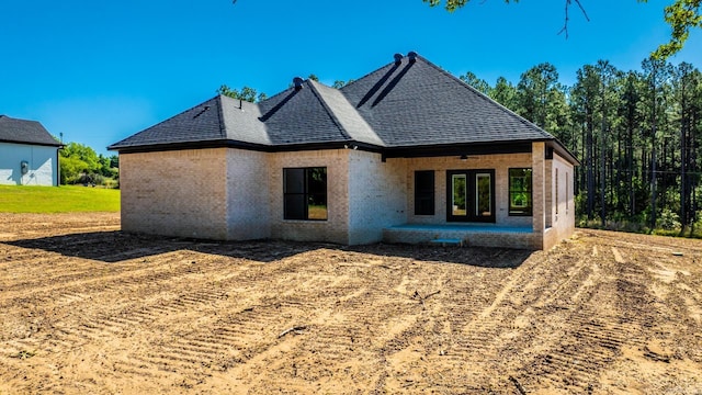 54 Lieblong Rd, Greenbrier, AR 72058 - rear view of property featuring a shingled roof, brick siding, and french doors