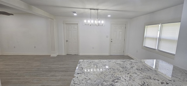 2720 S Spring St, Little Rock, AR 72206 - unfurnished dining area with wood finished floors, visible vents, recessed lighting, a chandelier, and baseboards
