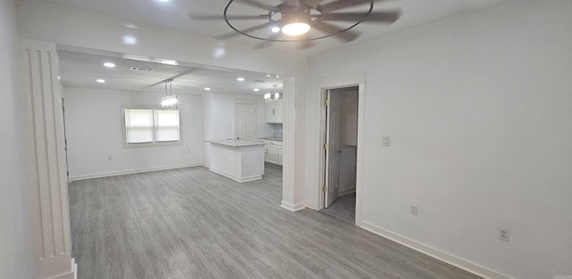 2720 S Spring St, Little Rock, AR 72206 - unfurnished living room with wood finished floors, visible vents, baseboards, ceiling fan, and recessed lighting