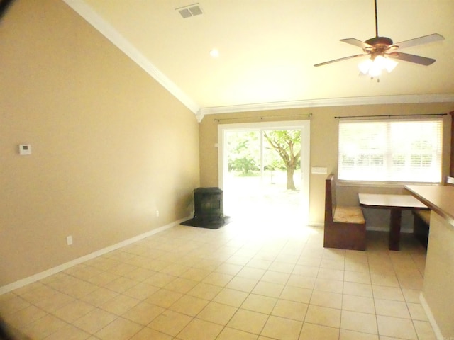 137 Gone Fishin Ln, Mena, AR 71953 - unfurnished living room with a wood stove, lofted ceiling, ornamental molding, light tile patterned flooring, and a ceiling fan