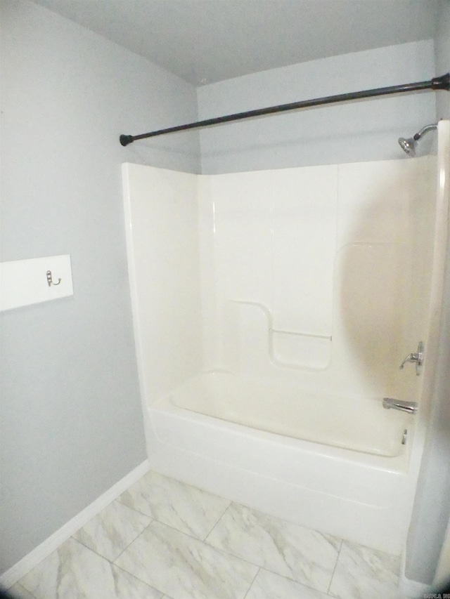 137 Gone Fishin Ln, Mena, AR 71953 - bathroom featuring baseboards,  shower combination, and marble finish flooring