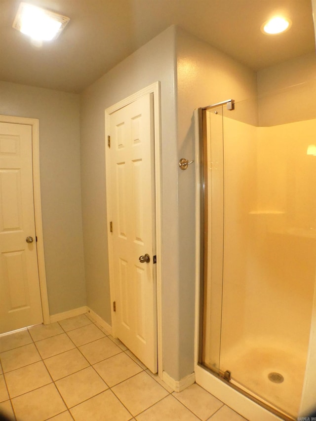 137 Gone Fishin Ln, Mena, AR 71953 - full bath featuring tile patterned flooring, a shower stall, baseboards, and recessed lighting