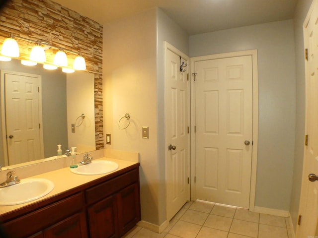 137 Gone Fishin Ln, Mena, AR 71953 - full bath with tile patterned flooring, double vanity, and baseboards