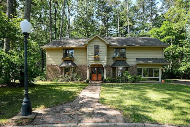 5 Southern Pines Cv, Pine Bluff, AR 71603 - view of front of property with a front yard and brick siding