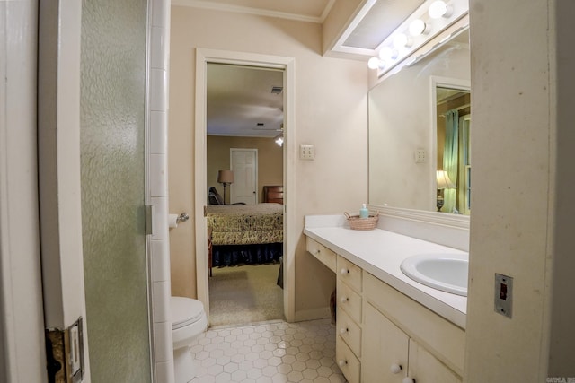 5 Southern Pines Cv, Pine Bluff, AR 71603 - ensuite bathroom featuring toilet, ensuite bathroom, vanity, ornamental molding, and tile patterned floors