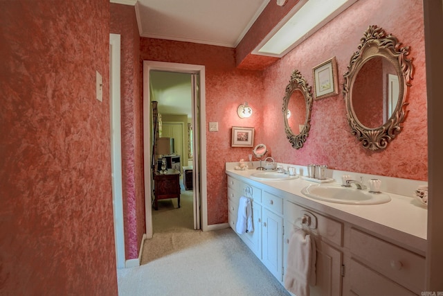 5 Southern Pines Cv, Pine Bluff, AR 71603 - bathroom featuring baseboards, ornamental molding, double vanity, and a sink