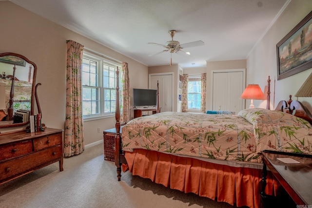 5 Southern Pines Cv, Pine Bluff, AR 71603 - carpeted bedroom with baseboards, crown molding, two closets, and a ceiling fan
