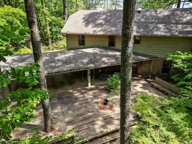 5 Southern Pines Cv, Pine Bluff, AR 71603 - back of property with a shingled roof