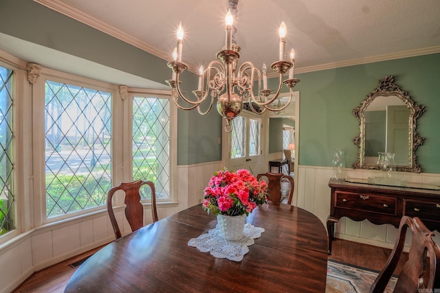 5 Southern Pines Cv, Pine Bluff, AR 71603 - dining area with a wainscoted wall, a wealth of natural light, and a chandelier