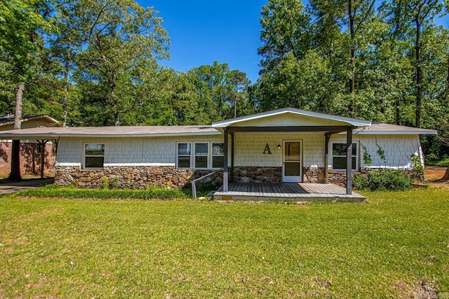 1504 W Woodson Lateral Rd, Hensley, AR 72065 - view of front of home featuring covered porch, a carport, stone siding, and a front yard