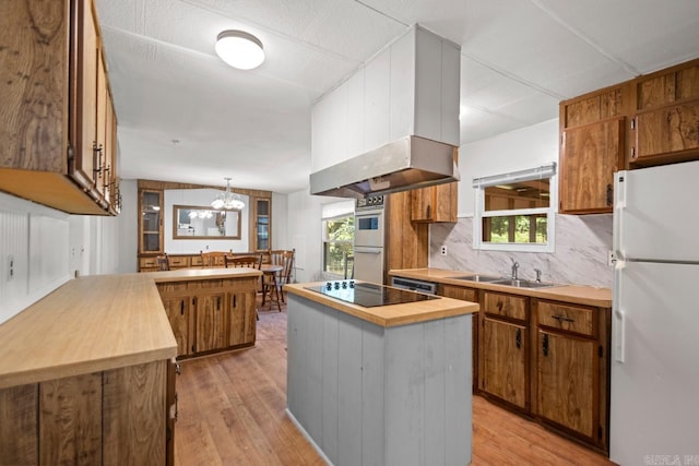 1504 W Woodson Lateral Rd, Hensley, AR 72065 - kitchen with a sink, extractor fan, white appliances, butcher block counters, and light wood-type flooring