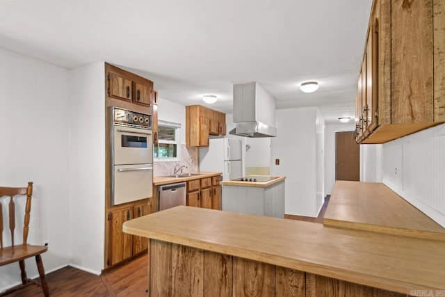 1504 W Woodson Lateral Rd, Hensley, AR 72065 - kitchen featuring a sink, white appliances, brown cabinets, light countertops, and dark wood-style floors
