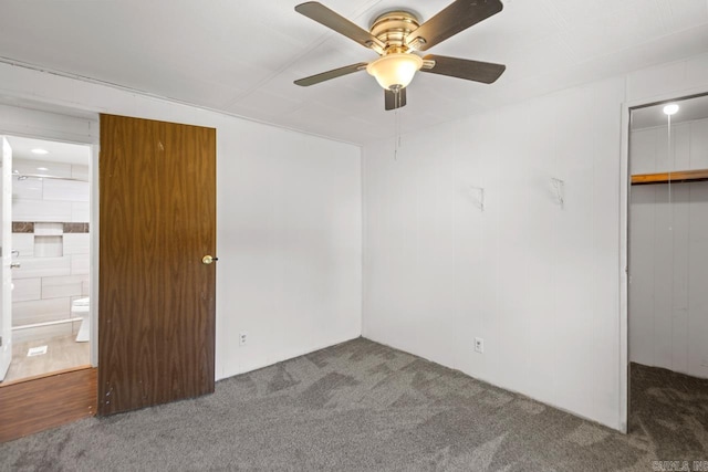 1504 W Woodson Lateral Rd, Hensley, AR 72065 - unfurnished bedroom featuring a spacious closet, carpet, a closet, and a ceiling fan